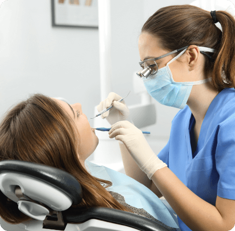 Dental hygienist giving a patient a teeth cleaning