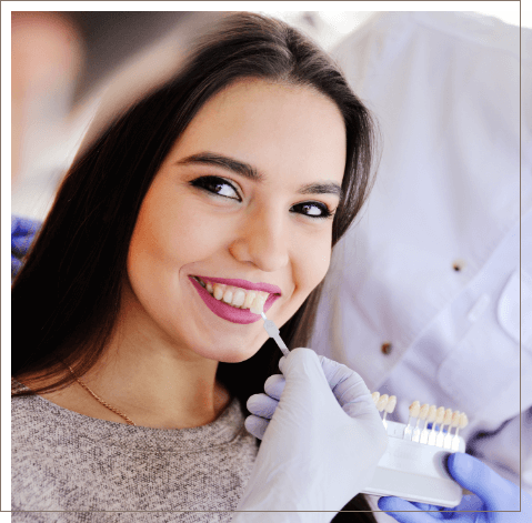 Young woman getting dental veneers from cosmetic dentist in Oklahoma City