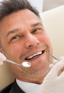 Man smiling in the dental chair in Yukon